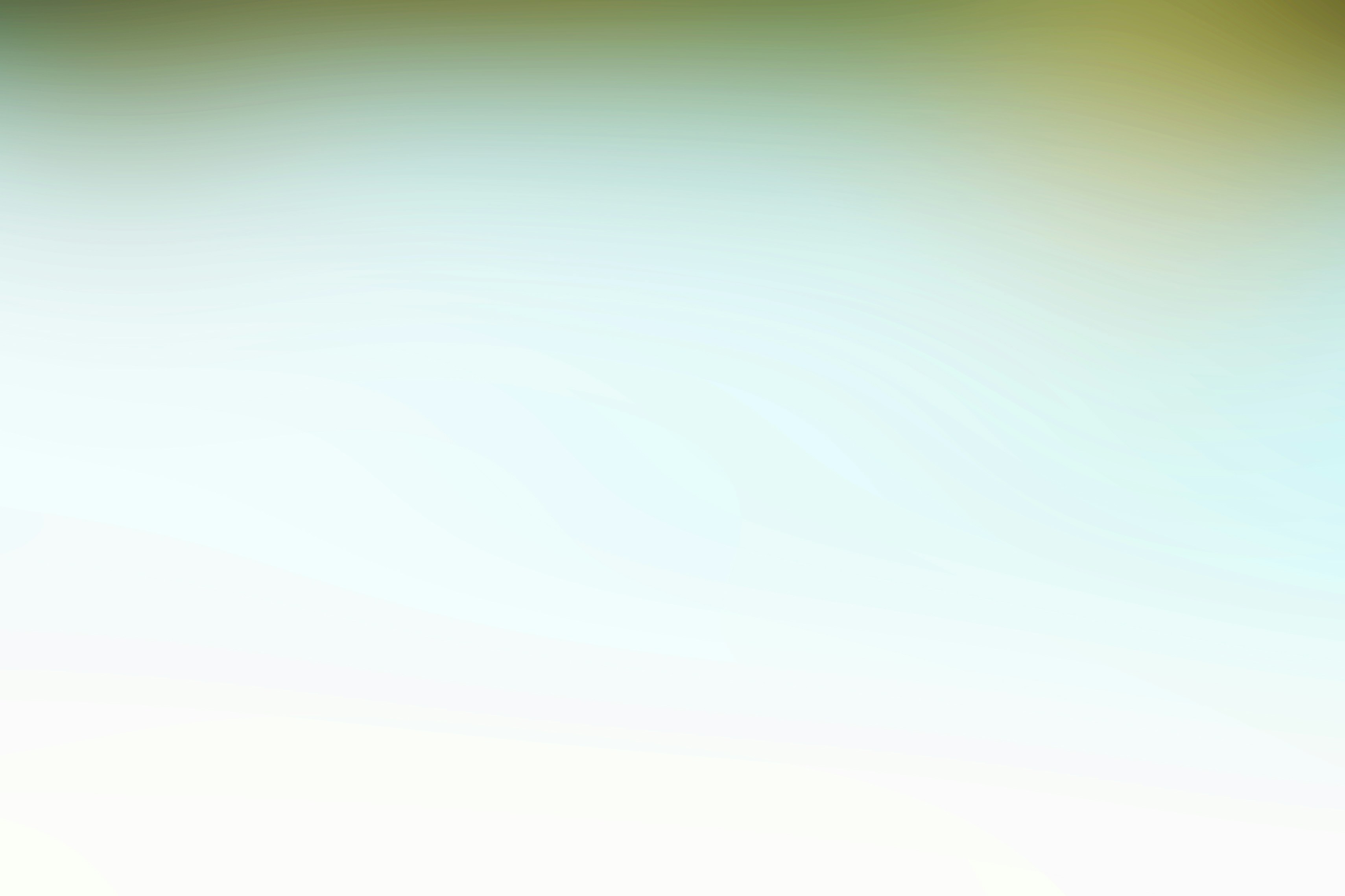 a blurry image of a green and yellow background